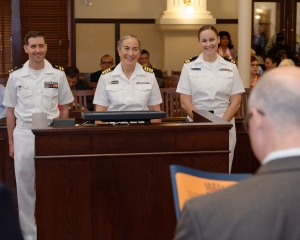 160419-N-NW169-006 SAN ANTONIO (April 19, 2016) Capt. Elizabeth Montcalm-Smith, Commander, Naval Medical Research Unit - San Antonio, center, Lt Jason Fischer, assigned to Navy Office of Community Outreach, left, and Lt Kathryn Gray, assigned to Navy Office of Community Outreach, right, accepts an official proclamation of Navy Week from Bexar County Commissioners Court. Navy Week San Antonio coincides with Fiesta San Antonio which started in 1891 to honor the memory of the heroes of the Alamo and the Battle of San Jacinto. The Navy Week program is designed to raise awareness about the Navy in areas across the country that traditionally do not have a naval presence, and to bring America's Navy closer to the people it protects through community relations projects, speaking engagements, science, technology, engineering, mathematics (STEM) demonstrations and media interviews with flag hosts and local area Sailors. (U.S. Navy photo by Chief Mass Communication Specialist Michael O’Day/Released)