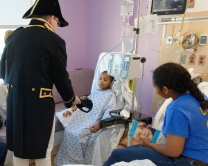 160422-N-NW169-009 SAN ANTONIO (April 22, 2016) Lt. Cmdr. Timothy Anderson, the executive officer of USS Constitution, presents a Navy command ball cap to a patient at Children's Hospital of San Antonio during a Caps for Kids visit. The Sailors from Old Ironsides are participating in San Antonio’s Navy Week. The Navy Week program is designed to raise awareness about the Navy in areas across the country that traditionally do not have a naval presence, and to bring America's Navy closer to the people it protects through community relations projects, speaking engagements, science, technology, engineering, mathematics (STEM) demonstrations and media interviews with flag hosts and local area Sailors. (U.S. Navy photo by Chief Mass Communication Specialist Michael O’Day/Released)